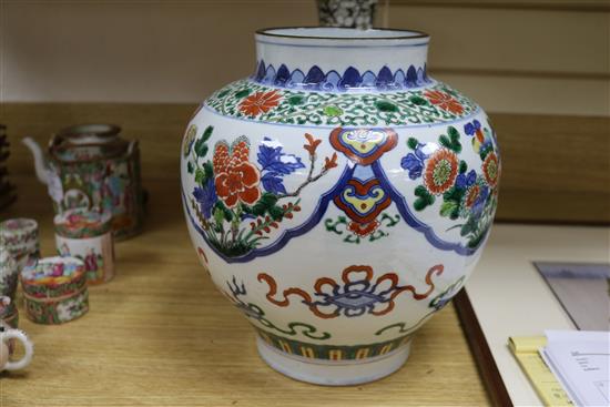 A Chinese wucai jar, a prunus and cracked ice vase and a bamboo brush pot tallest 32cm